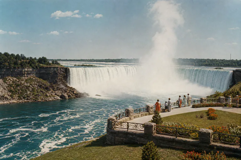 1950s-inspired travel postcard photograph of Niagara Falls from a public scenic lookout.
